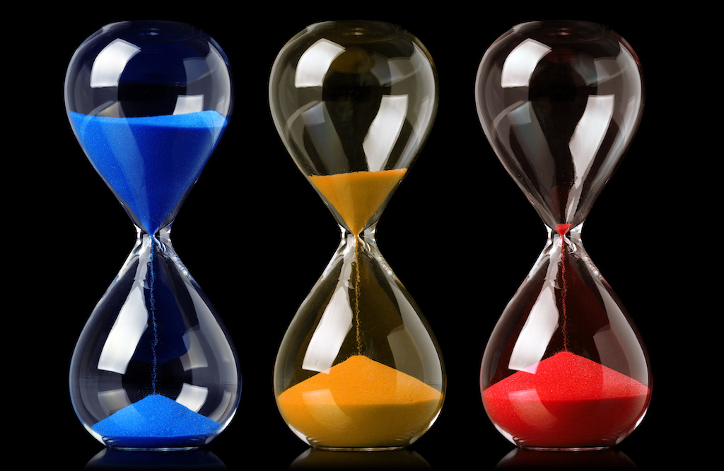 Collection of colorful hourglasses showing the passage of time